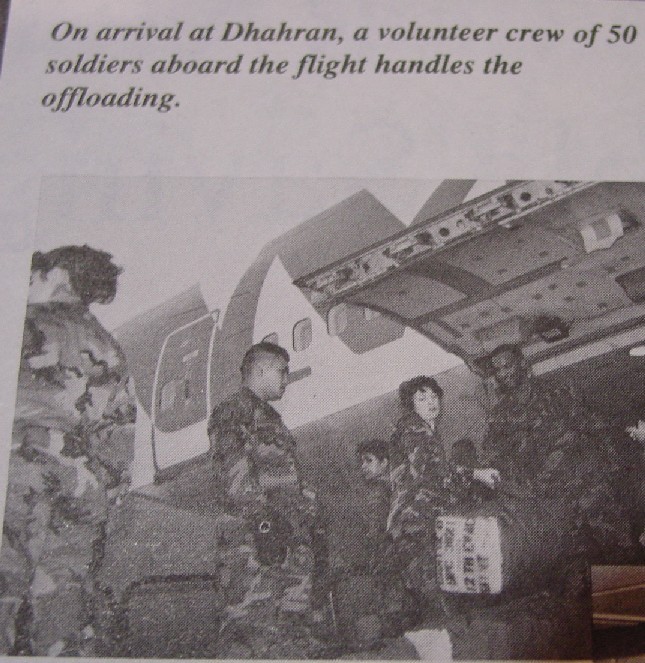 1990, December, A group of  soldiar unload luggage from a 747 in Dhahran, Saudi Arabia as Pan Am delivers another group of soldiars to participate in Operation Desert Storm.